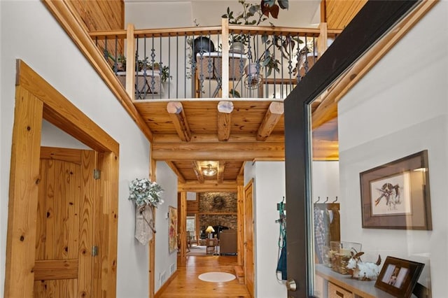 5505 Whitehall Rd, Lula, GA 30554 - corridor featuring wood ceiling, beamed ceiling, rustic walls, and wood finished floors
