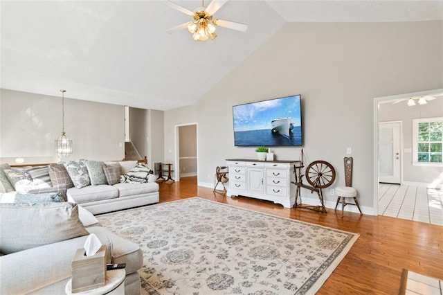 533 Coolsprings Walk, Woodstock, GA 30188 - living area with ceiling fan, high vaulted ceiling, and light wood-style flooring