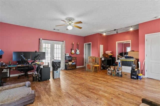 533 Coolsprings Walk, Woodstock, GA 30188 - office area with wood finished floors, ceiling fan, a textured ceiling, french doors, and track lighting