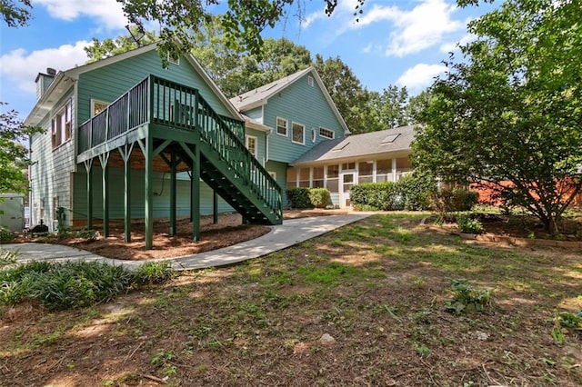 533 Coolsprings Walk, Woodstock, GA 30188 - rear view of property with stairs, a sunroom, and a wooden deck