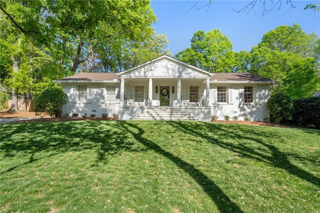 1305 Old Woodbine Rd, Atlanta, GA 30319 - view of front of house featuring a front yard, covered porch, and crawl space