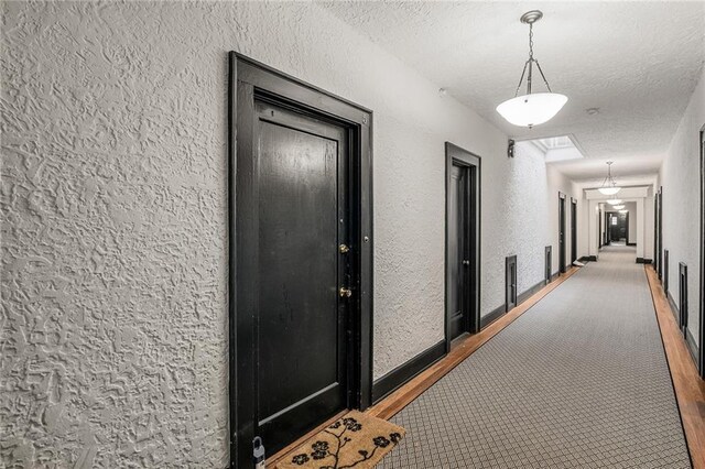 hall featuring crown molding and light wood-type flooring