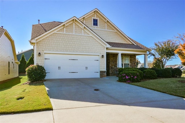 craftsman-style home with a garage and a front yard