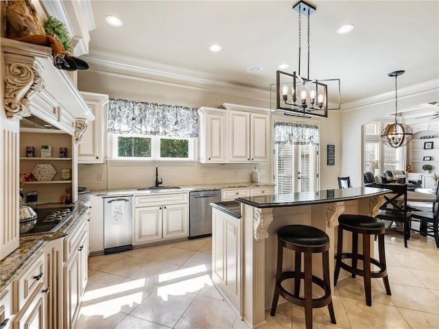 kitchen with sink, gas stovetop, decorative light fixtures, a center island, and dishwasher