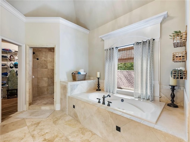 bathroom with ornamental molding and plus walk in shower