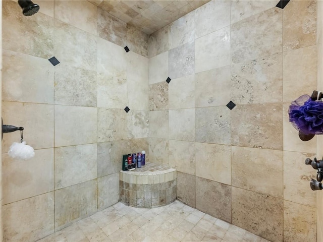 bathroom with tiled shower