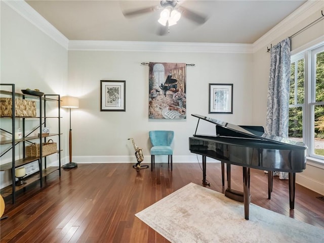 sitting room with crown molding, dark wood-type flooring, and ceiling fan