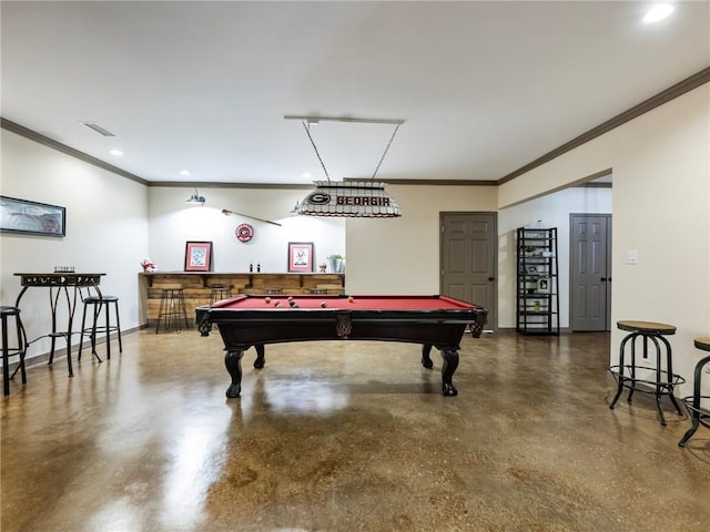 rec room with ornamental molding, billiards, concrete floors, and bar area