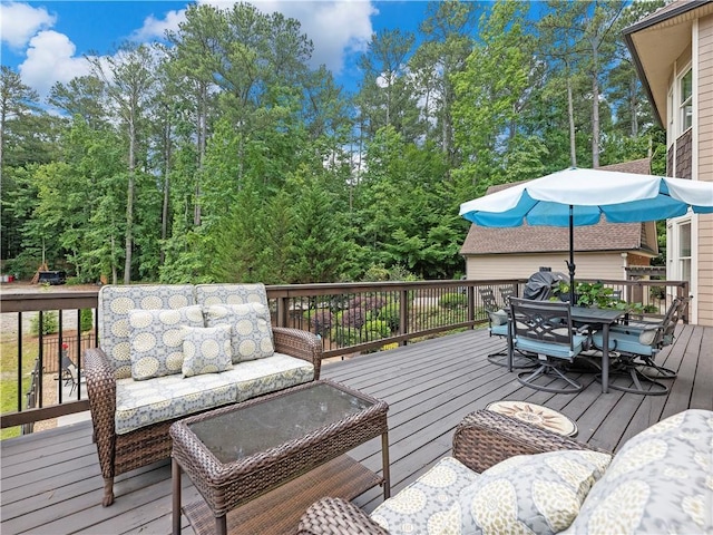 wooden terrace with an outdoor hangout area