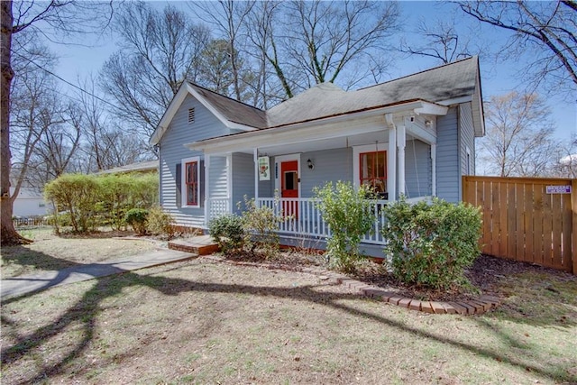 bungalow-style house with fence and a porch