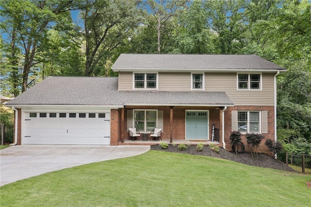 4733 Eidson Rd, Dunwoody, GA 30360 - traditional-style home featuring covered porch, a garage, concrete driveway, brick siding, and view of wooded area