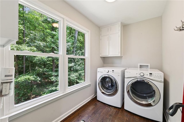 4733 Eidson Rd, Dunwoody, GA 30360 - laundry area with independent washer and dryer, dark wood-type flooring, baseboards, and cabinet space