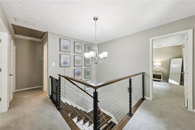 4733 Eidson Rd, Dunwoody, GA 30360 - hallway with an upstairs landing, carpet, a chandelier, and baseboards
