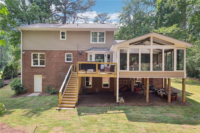 4733 Eidson Rd, Dunwoody, GA 30360 - rear view of house featuring stairs, a sunroom, brick siding, and a lawn