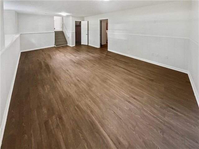 spare room with dark wood-type flooring