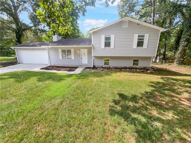 split level home with a garage and a front yard