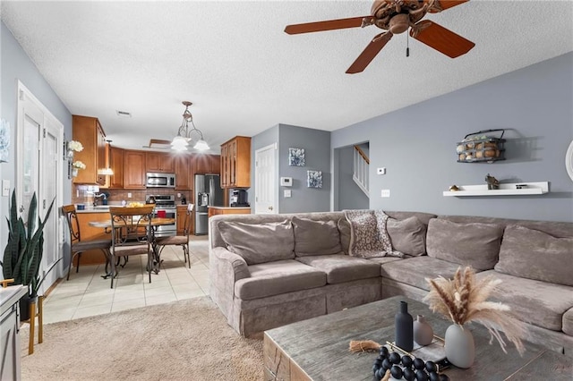 10 Callaway Ct, Hiram, GA 30141 - living area with light tile patterned floors, ceiling fan, stairway, light carpet, and a textured ceiling
