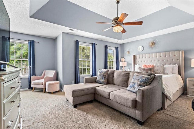 10 Callaway Ct, Hiram, GA 30141 - carpeted bedroom with multiple windows, a ceiling fan, and a textured ceiling