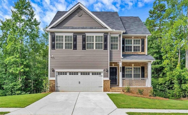 craftsman inspired home with a front yard, covered porch, brick siding, and an attached garage