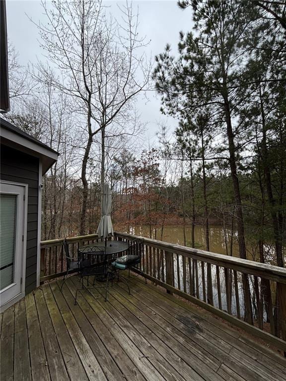 wooden deck with outdoor dining area