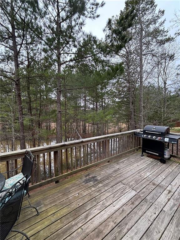 wooden terrace featuring area for grilling