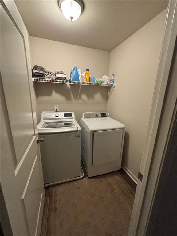 washroom featuring laundry area and washing machine and dryer