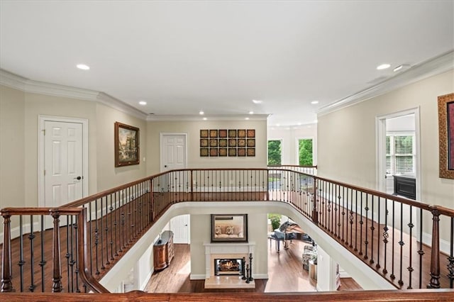 7025 Kettering Ln, Suwanee, GA 30024 - stairway featuring recessed lighting, crown molding, wood finished floors, and baseboards