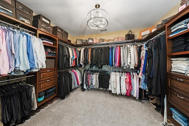 7025 Kettering Ln, Suwanee, GA 30024 - spacious closet with a chandelier and carpet flooring
