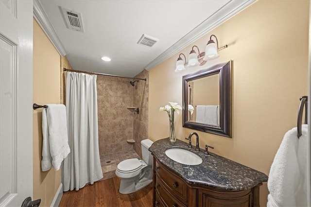 7025 Kettering Ln, Suwanee, GA 30024 - bathroom featuring toilet, wood finished floors, a tile shower, vanity, and ornamental molding