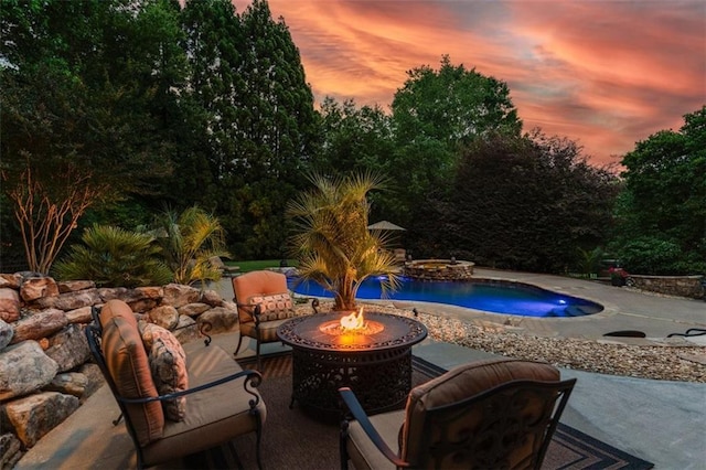 7025 Kettering Ln, Suwanee, GA 30024 - pool at dusk with a patio, an outdoor pool, and an outdoor living space with a fire pit