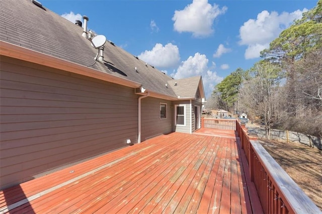 wooden terrace featuring fence