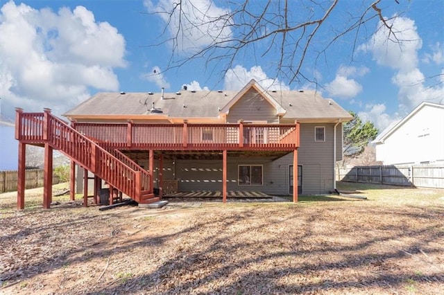 back of house with stairway, fence, and a wooden deck