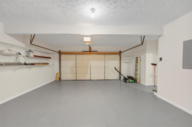 garage featuring a garage door opener, electric panel, and baseboards