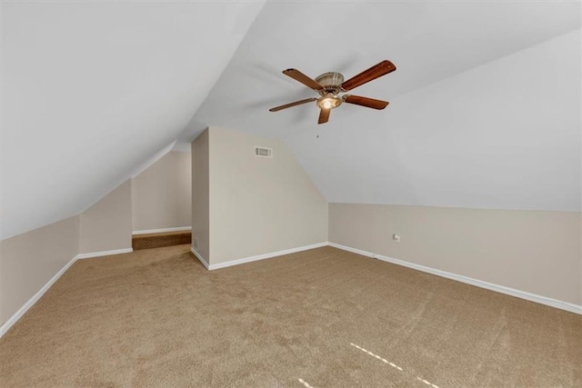 bonus room with vaulted ceiling, carpet, visible vents, and baseboards