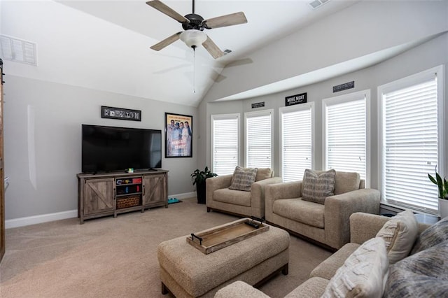 living room featuring vaulted ceiling, light colored carpet, and ceiling fan