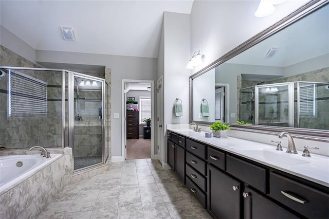 bathroom with independent shower and bath, vanity, and lofted ceiling