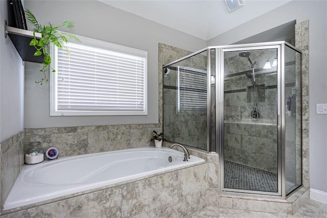 bathroom featuring separate shower and tub