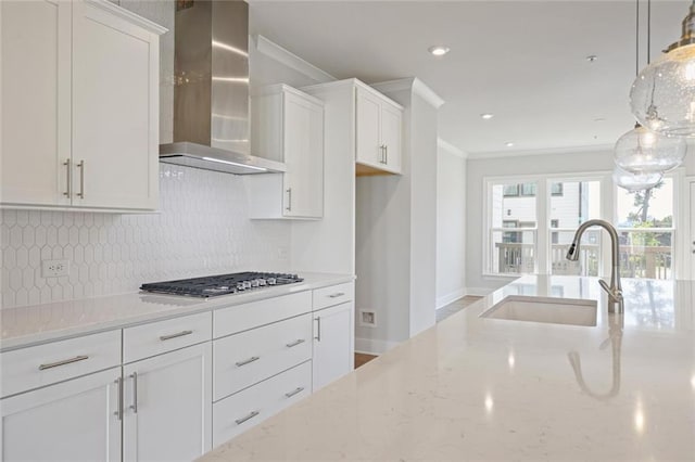 1030 Burnside Pl NW, Atlanta, GA 30318 - kitchen with wall chimney range hood, a sink, stainless steel gas stovetop, ornamental molding, and white cabinets