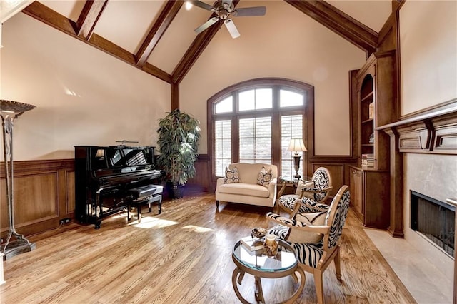 8340 Royal Melbourne Way, Duluth, GA 30097 - sitting room featuring high vaulted ceiling, a wainscoted wall, ceiling fan, beamed ceiling, and light wood finished floors