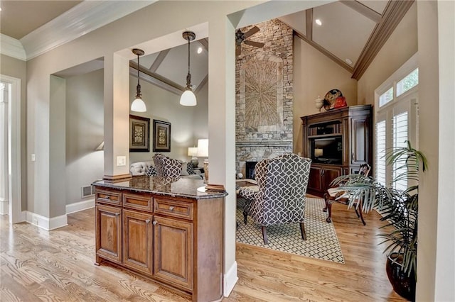 8340 Royal Melbourne Way, Duluth, GA 30097 - sitting room with ornamental molding, light wood-style floors, a fireplace, baseboards, and high vaulted ceiling