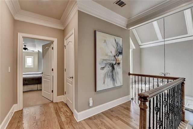8340 Royal Melbourne Way, Duluth, GA 30097 - hallway featuring light wood-style flooring, crown molding, baseboards, an upstairs landing, and a chandelier