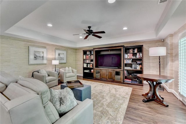 8340 Royal Melbourne Way, Duluth, GA 30097 - living area with a ceiling fan, wood finished floors, wallpapered walls, recessed lighting, and a raised ceiling
