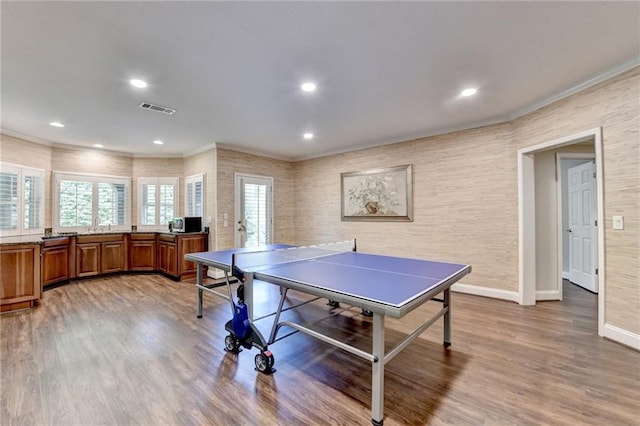8340 Royal Melbourne Way, Duluth, GA 30097 - playroom with light wood-style flooring, baseboards, crown molding, and recessed lighting