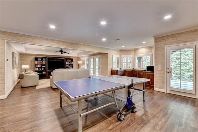 8340 Royal Melbourne Way, Duluth, GA 30097 - playroom featuring dark wood-type flooring, plenty of natural light, baseboards, recessed lighting, and crown molding