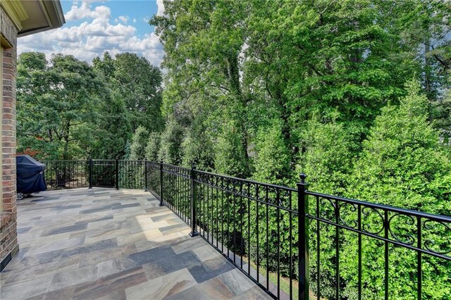 8340 Royal Melbourne Way, Duluth, GA 30097 - balcony with area for grilling and a wooded view