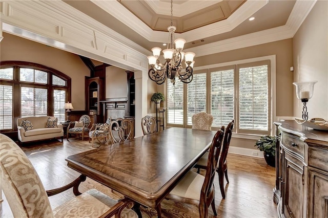 8340 Royal Melbourne Way, Duluth, GA 30097 - dining room featuring a chandelier, wood finished floors, and ornamental molding