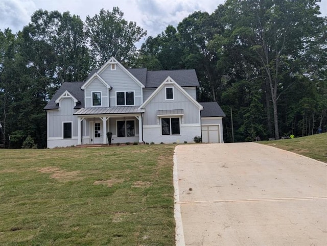 9110 Greenway Ct, Gainesville, GA 30506 - modern farmhouse style home featuring board and batten siding, a porch, concrete driveway, and a front lawn