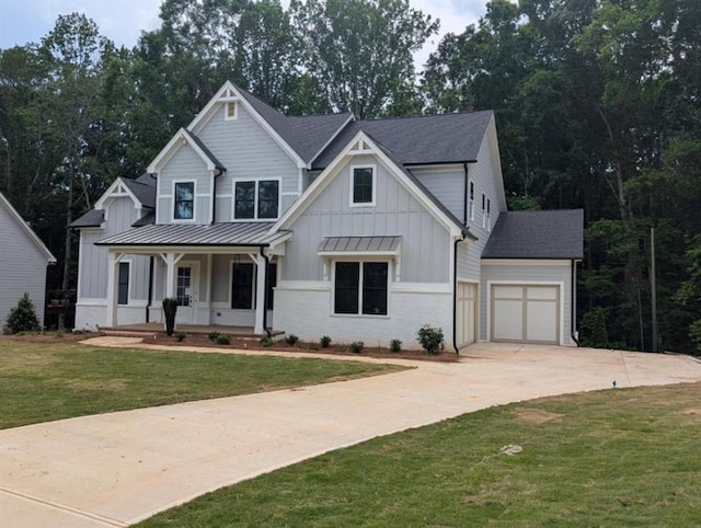 9110 Greenway Ct, Gainesville, GA 30506 - modern inspired farmhouse with a porch, board and batten siding, driveway, a front lawn, and a garage
