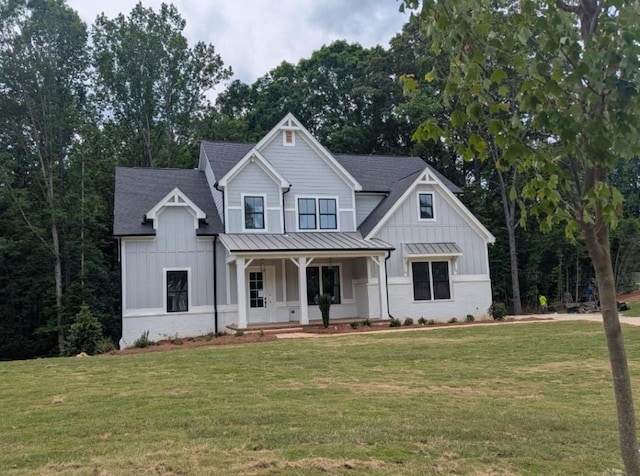 9110 Greenway Ct, Gainesville, GA 30506 - modern inspired farmhouse with covered porch, board and batten siding, a standing seam roof, a front lawn, and metal roof