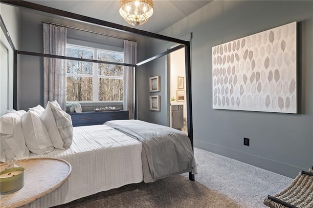 9110 Greenway Ct, Gainesville, GA 30506 - bedroom featuring carpet flooring, ensuite bath, baseboards, and a chandelier